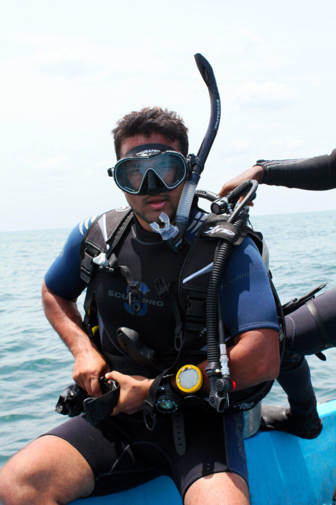 Scuba Diver setting-up his equipment before Diving at Temple Reef in Pondicherry, India