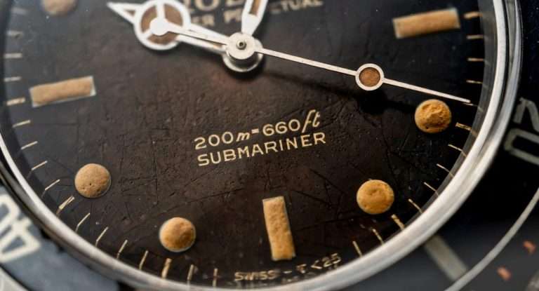 Vintage Rolex Submariner with tropical gilt dial showing aged lume and patina